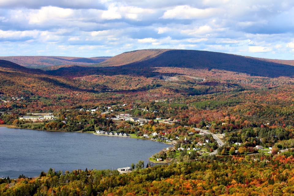 Whycocomagh, in Inverness County, Nova Scotia, Canada.  It's name is from the aboriginal Mi'kmaq language, but is locally known by a Gaelic rendering of Hogamagh.  The village is in the heart a formerly Gaelic-speaking region.  A small number of people still speak that language in a distinctly Canadian dialect.