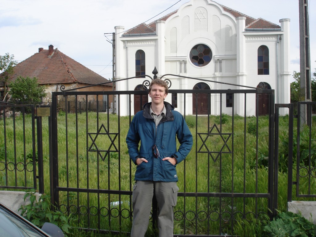 Isaac in front of the abandoned synagogue where his grandfather probably had his Bar Mitzvah.