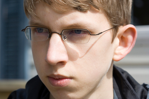 Close-Up Of Teenager Wearing Eyeglasses
